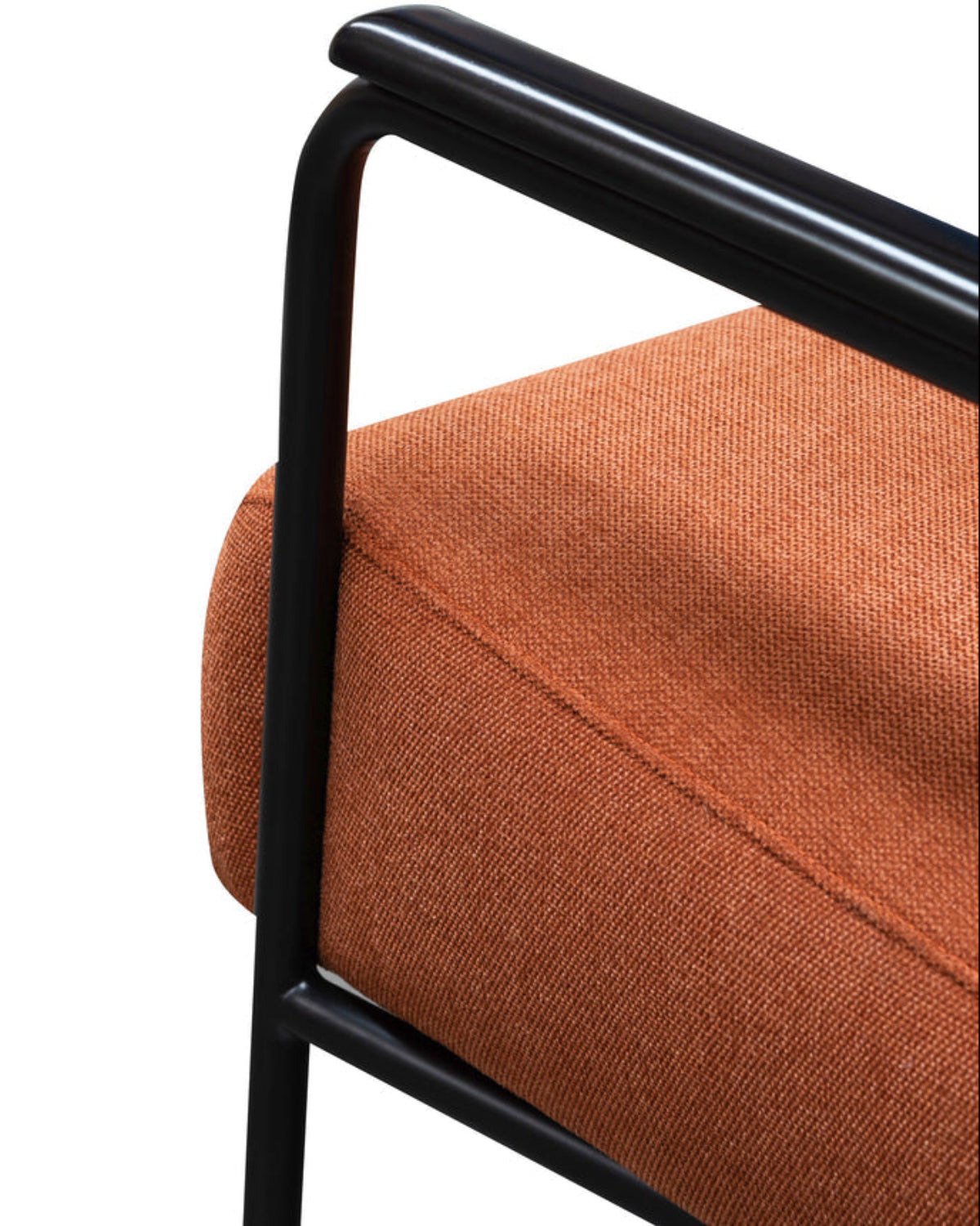 Close-up of an orange upholstered chair with black metal frame on a white background