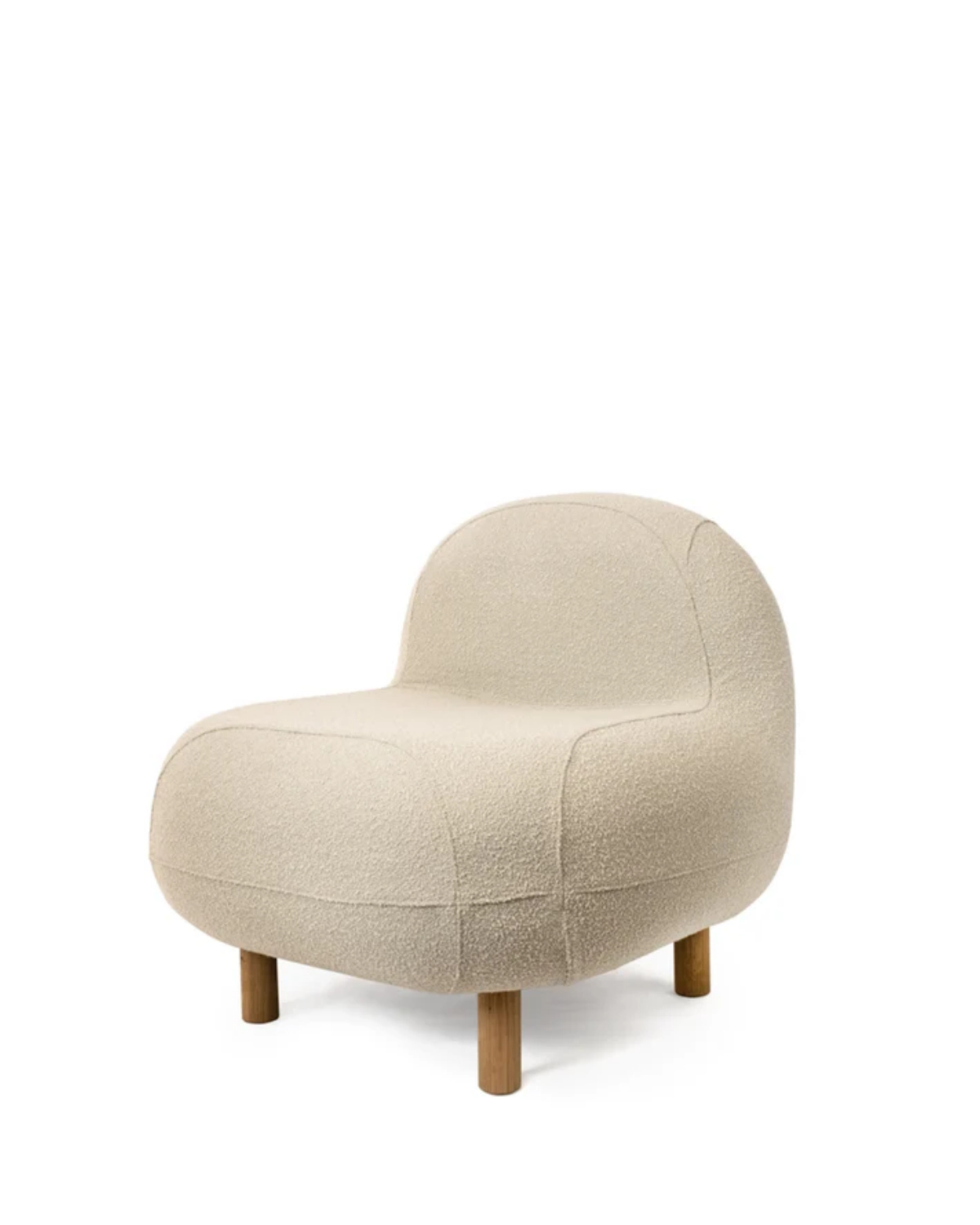 A modern low-profile accent chair upholstered in a textured cream bouclé fabric, featuring a rounded organic silhouette and short wooden legs, shown against a plain white background.