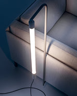 Baia lamp zoomed in image, attached to bottom of couch.
