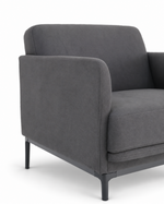A modern gray upholstered armchair with dark tapered legs, shown from a three-quarter angle against a plain white background.
