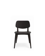 A modern black dining chair with a curved backrest, flat seat, and tapered legs, shown against a plain white background.
