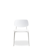 A minimalist white dining chair with a molded seat and backrest and slim metal legs, shown against a solid white background.