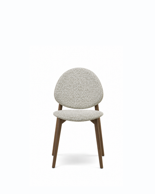 A modern dining chair with a textured light beige bouclé upholstered seat and rounded backrest, supported by four tapered dark brown wooden legs, shown against a plain white background.