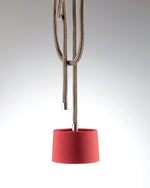 Red pendant light with a rope