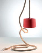 Red pendant light with braided beige cable on a gradient background