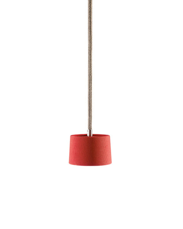 Minimalist pendant light with a white shade on a white background