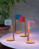 Set of different coloured Gaia Table Lamps on a table.
