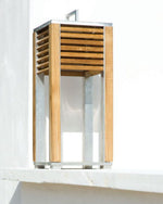 Ginger Table Lamp placed outdoors on a white ledge.