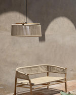 Kilt suspension lamp outdoors in natural teak with round rope sand pictured with matching bench