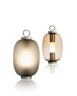 Two different styles of the Lucerna Outdoor Lamp - one with the foggy glass, one with the transparent glass.