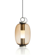 Lucerna Suspension Lamp with transparent glass and brass-plated aluminium frame.
