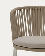 Beige wicker chair with a cushioned seat on a white background