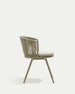 Sage green chair with a woven design on a white background