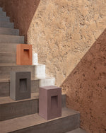 All colours of the Step Square Path Lamp placed on steps in a staircase.