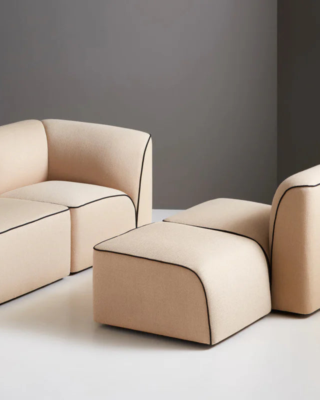 Beige modern sofa and chair set on a gray background