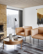 Arc Coffee Table in walnut styled in a contemporary living room — Scandinavian furniture piece with rotating lid and hidden storage.