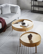 Arc Coffee Table in oiled oak styled in a modern living room — Scandinavian furniture with rotating lid.