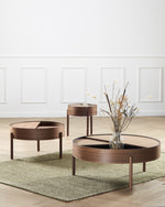Arc Coffee Table in walnut with lid open showing hidden storage compartment lined with nanolaminate.