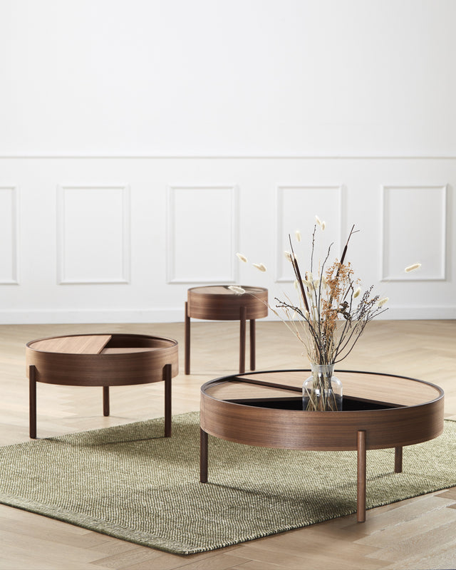 Arc Coffee Table in walnut with lid open showing hidden storage compartment lined with nanolaminate.