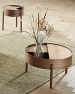 Close-up of Arc Coffee Table’s solid walnut three-leg base and geometric structure.