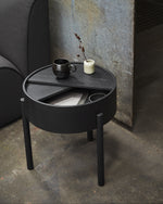 Arc Side Table in black styled in modern living room — Scandinavian furniture piece with rotating lid and hidden storage.