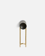 Detail of solid oak wood grain and satin brass metal of small Around wall hanger.