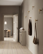 Around wall hanger (oak & black) installed in hallway — decorative & functional wall hook.