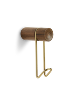 Around wall hanger in matte walnut with satin brass hook — small size from WOUD.