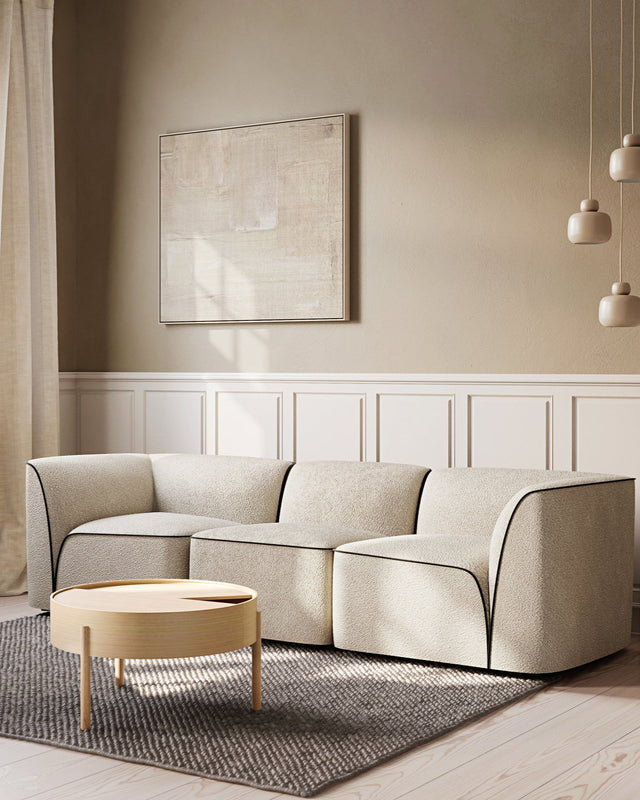 Flora 2.5 Seater in Natural bouclé styled in a modern living room with minimalist décor.