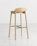 Side profile of Mono Bar Stool showcasing its minimalist design and oak construction
