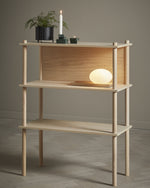 Pidestall Planter (Small Black) with greenery in modern interior setting