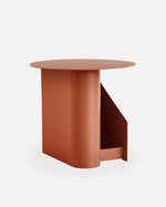 Sentrum Side Table in burnt orange painted metal, sculptural S-shaped design with dual storage spaces.