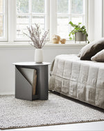 Detailed view of the two storage slots on the Sentrum Side Table for magazines/books.