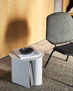 Detailed view of the two storage slots on the Sentrum Side Table for magazines/books.