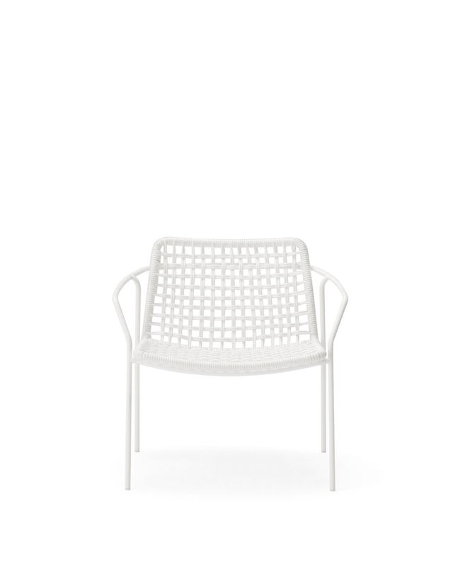 White chair with a woven design on a white background