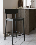 Soma Counter Chair placed at a modern kitchen island, complementing a Scandinavian interior
