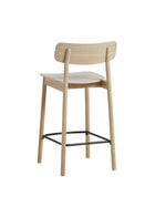 Back profile of Soma Counter Chair showcasing its minimalist design and oak construction